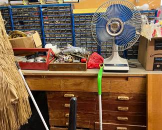 Here you can see a table fan, more parts drawers, and a handheld toolbox.  Also, what's in those drawers?