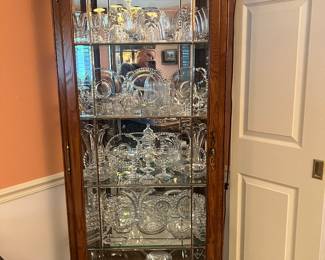 Lighted Curio Cabinet filled with a Candlewick collection. 