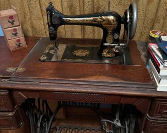 singer sewing machine in cabinet