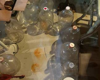 Jars for wine making some with Coca-cola lids