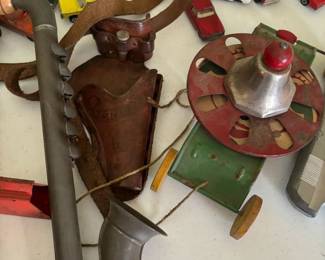 tin Sax, leather holster and tin pull toy