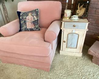Pink upholstered occasional chair with cute painted end table and decorative bunny lidded container