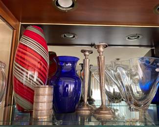 Sterling candlesticks and art glass vases.