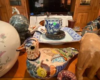 A shot of the 55" Samsung TV with decorative items in the foreground.