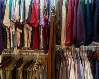One of the closets filled with nice men's clothing