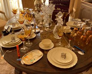 This isn't the greatest pic.  We'll get a better one up soon.  This is a view of the dining table.  Background shows the chest of Towle sterling flatware(service for 12), gorgeous stemware, silver coffee server, and Lenox china set.