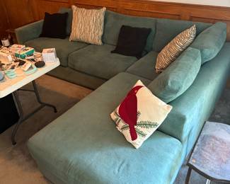Green sectional with 4 throw pillows
