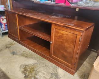 Wood TV stand
Lots of niks n dings but extremely sturdy and stable. 
$65