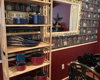 Eating area adjacent to kitchen with more pots & pans