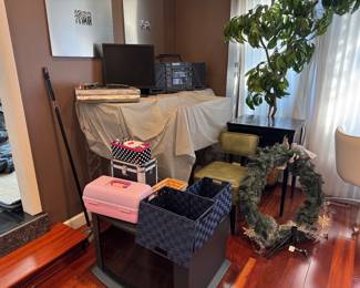 Wreath, baskets, monitor, desk with chair, stereo.