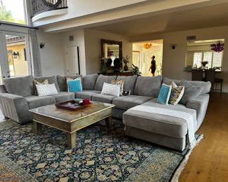 This is a very comfortable dove gray sectional. large over 13 feet at back. super nice!!!