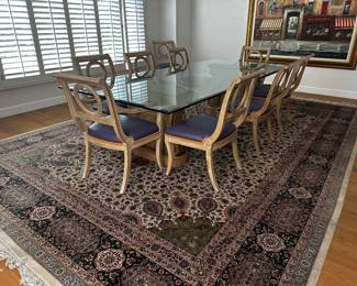 Very nice dining table 10 chairs 9 1/2' long. THE RUG THE FAMILY IS KEEPING