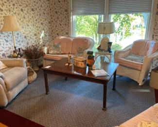 Power swivel recliner, Fine Arts Furniture Co. coffee table, White wicker plant stand, White wicker accent table with glass top, White wicker chairs

