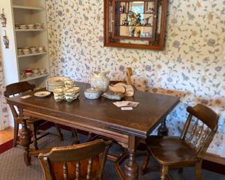 Mirrored shadow box display, Porcelain bird figurines, 	Colonial style wood dining chairs,Wood dining table
