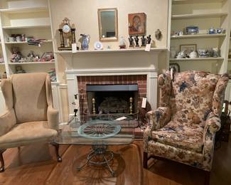 Two upholstered chairs and a Wrought iron Coffee Table