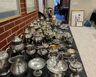 Tables full of beautiful silverplate serving pieces