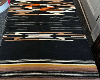 Navajo blanket laying on an 8 foot table