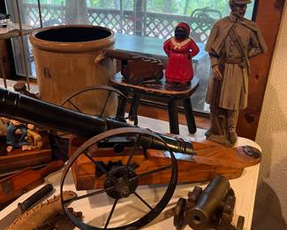 27” Cast Iron Cannon on wooden base 
Smaller cast iron cannons 