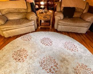 Pair of Leather reclining chairs and round accent rug