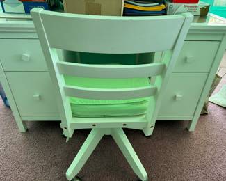 White desk with green cushion