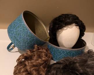 Vintage wig storage case with 4 wigs