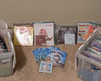 Boxes and boxes of teacher listening centers, books, and other elementary school materials for the classroom.