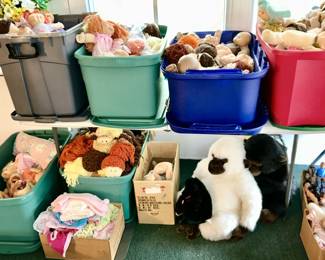 Many totes filled with Cabbage Patch dolls