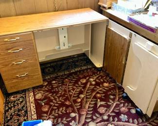 Multi-purpose sewing/crafting table with drawers, folding door and hinged drop down table leaf