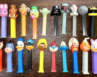 Many vintage PEZ dispensers