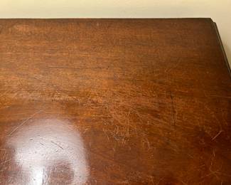 Detail of top of bowfront chest.