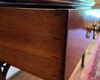 detail of dovetails on drawer from marble top table