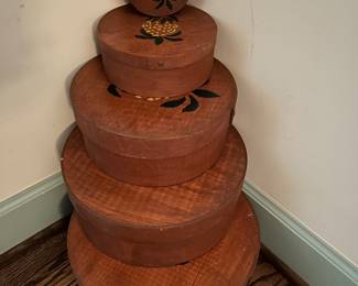 Lot#83 - $65 -Set of 5 wooden lidded round boxes with pineapple stencil on tops. Largest one is 12-3/4” diameter. Smallest is 4”