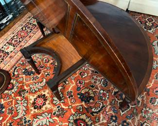 To convert from round to demilune, lift the edge and slide the 2 legged support in.