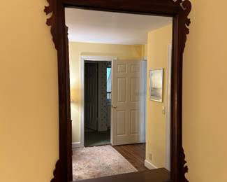 Lot #56 - $140 - Mirror over mahogany chest. 24-1/2" x 36"