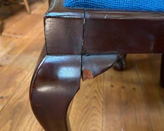 And the same chair is chipped on the corner piece of the left front leg. The chair is still structurally sound