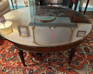 Lot #18 - $150- Round convertible demilune coffee table. Demilune has embossed leather top. Round top has removeable glass top. 4' Diameter