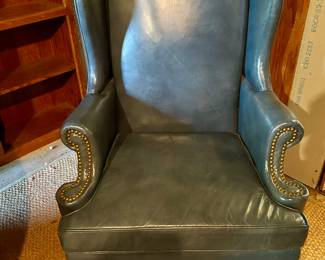 Lot #65 - $100 -Blue leather wing chair by Tarkington. 42"H x 30"W x 29"D