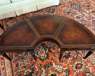 detail of leather top demilune table