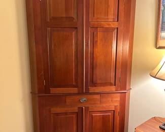 Lot #54 - $295 - Cherry corner cabinet. 82"H x 43"W x 29"D