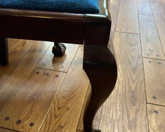 The same side chair is missing a corner piece on front right leg