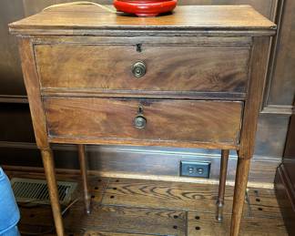 Lot #28 - $125 -Small work table / side table. Top lifts (top drawer is false). Bottom drawer is functional. The wood is split along the back right, but could be fixed.