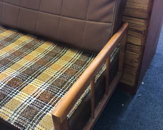 CLOSE UP SIDE VIEW OF A RARE PAIR OF 2  MID=CENTURY DAYBEDS WITH ORIGINAL PLAID UPOLSTERY THAT BOTH WERE COVERED WITH PROTECTIVE COVER FOR OVER 70 YEARS.  EXCELLENT CONDITION.