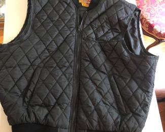 CLOSE UP VIEW OF HARLEY DAVIDSON QUILTED QUILT VEST THAT GOES TO JACKET.
