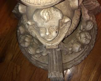 CLOSE UP VIEW OF PERIOD ERA ORNATE CARVED CHEREBS FORAL   FLOOR BASE FROM THE LAWRENCE FISHER MANSION