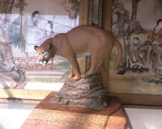 RARE MOUNTAIN COUGAR PORCELAIN FIGURE ON WOODEN PEDESTAL.
