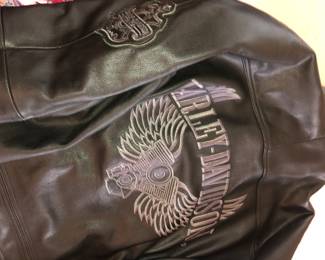 BACK OF HARLEY DAVIDSON HEAVY LEATHER ROAD WARRIOR JACKET MEASURING XXL, WITH QUILTED JACKET VEST AND LEATHER HARLEY LEATHER PANTS.  ALL IN EXCELLENT CONDITION.