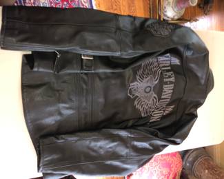 BACK OF HARLEY DAVIDSON HEAVY LEATHER ROAD WARRIOR JACKET MEASURING XXL, WITH QUILTED JACKET VEST AND LEATHER HARLEY LEATHER PANTS.  ALL IN EXCELLENT CONDITION.