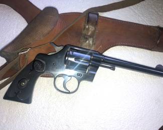 CLOSE UP VIEW OF 1930'S NAVAL COLT PISTOL IN EXCLLENT 95% CONDITION WITH LEATHER HOLSTER
