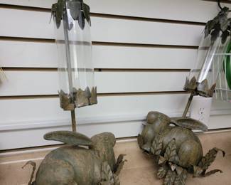 These bunny candle holders are heavy and hang on a wall