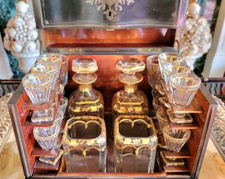 Care for a cordial from this Napoleon III style Tantalus with gilded glassware?